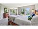 Bright, spacious main bedroom featuring large windows and a comfortable queen-size bed at 12993 E 131St St, Fishers, IN 46037