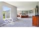 Spacious main bedroom with ample natural light, carpet flooring and a neutral color palette at 12993 E 131St St, Fishers, IN 46037