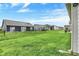Beautiful backyard view showcasing the lush green lawn and neighboring houses at 1334 Sunnybrook Ln, Greenwood, IN 46143