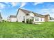Manicured backyard of a charming home, featuring a patio and well-maintained lawn at 1334 Sunnybrook Ln, Greenwood, IN 46143