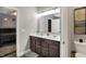 Bright bathroom featuring a double vanity, a modern mirror, and neutral paint at 1334 Sunnybrook Ln, Greenwood, IN 46143