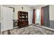 Charming bedroom featuring a vintage wooden hutch, modern lighting, and large windows at 1334 Sunnybrook Ln, Greenwood, IN 46143