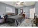 Cozy bedroom with ceiling fan, patterned rug, and natural wood accents at 1334 Sunnybrook Ln, Greenwood, IN 46143