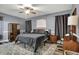 Comfortable bedroom with neutral color scheme, ceiling fan, and ample natural light at 1334 Sunnybrook Ln, Greenwood, IN 46143