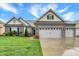 Charming single-Gathering home with a brick facade, well-manicured lawn, and a spacious three-car garage at 1334 Sunnybrook Ln, Greenwood, IN 46143