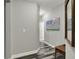 Hallway with modern decor, wall art, and wood-look flooring at 1334 Sunnybrook Ln, Greenwood, IN 46143