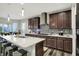 Gourmet kitchen with stainless steel appliances, white countertops, tiled backsplash, and dark stained cabinets at 1334 Sunnybrook Ln, Greenwood, IN 46143