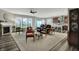 Bright living room boasting large windows, comfortable seating, and a ceiling fan for added comfort at 1334 Sunnybrook Ln, Greenwood, IN 46143