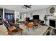 Spacious living room showcasing a fireplace, contemporary decor, and ample seating for entertaining at 1334 Sunnybrook Ln, Greenwood, IN 46143