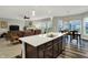 Open concept kitchen and living spaces featuring a center island and hardwood floors at 1334 Sunnybrook Ln, Greenwood, IN 46143