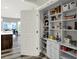 Open pantry with organized shelving and a view into the adjacent dining area at 1334 Sunnybrook Ln, Greenwood, IN 46143
