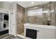 Beautiful walk-in shower with stylish tile, glass door, and rain shower head at 1334 Sunnybrook Ln, Greenwood, IN 46143
