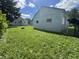 Spacious backyard with garage and outbuilding offers lots of extra parking and storage at 144 S 7Th Ave, Beech Grove, IN 46107