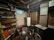 Unfinished basement space contains water heater, exposed ceilings, and storage areas at 144 S 7Th Ave, Beech Grove, IN 46107