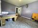 Bedroom with a bare wooden frame bed, carpet, and two windows at 144 S 7Th Ave, Beech Grove, IN 46107