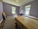 Spacious carpeted bedroom with two beds and plenty of natural light at 144 S 7Th Ave, Beech Grove, IN 46107