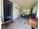 Enclosed front porch filled with seating and furniture at 144 S 7Th Ave, Beech Grove, IN 46107