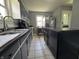 A kitchen with neutral colors, stainless steel appliances, and ample counter space at 144 S 7Th Ave, Beech Grove, IN 46107