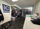 Large laundry room features hanging clothing rack, washer, dryer, and painted walls at 144 S 7Th Ave, Beech Grove, IN 46107