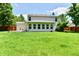 Expansive backyard featuring a well-maintained lawn, complemented by a charming home addition at 16857 Palmetto Way, Noblesville, IN 46062