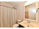 Cozy bathroom featuring a shower with a black and white curtain and a modern vanity with a framed mirror at 16857 Palmetto Way, Noblesville, IN 46062