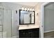 Modern bathroom with a walk-in shower, stylish vanity, updated lighting, and a neutral color palette at 16857 Palmetto Way, Noblesville, IN 46062