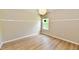 Cozy bedroom with hardwood floors, a pendant light, and a window with a view at 16857 Palmetto Way, Noblesville, IN 46062