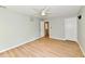 A spacious bedroom with hardwood floors, neutral paint, ceiling fan, and two entry doors at 16857 Palmetto Way, Noblesville, IN 46062