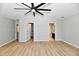 A spacious bedroom with hardwood floors, featuring a large closet and access to an ensuite bathroom at 16857 Palmetto Way, Noblesville, IN 46062