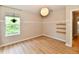 Bright bedroom with hardwood floors, pendant lighting and a window with greenery views at 16857 Palmetto Way, Noblesville, IN 46062