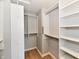 Walk-in closet with custom shelving and hanging rods, offering ample storage space at 16857 Palmetto Way, Noblesville, IN 46062