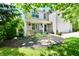Charming home featuring manicured landscaping, flower beds, and a welcoming covered porch at 16857 Palmetto Way, Noblesville, IN 46062