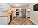 Well-lit kitchen featuring white cabinets, stainless steel appliances, and butcher block countertops at 16857 Palmetto Way, Noblesville, IN 46062