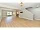 Open living space with wood floors, fresh paint, and an open stairway to the second floor at 16857 Palmetto Way, Noblesville, IN 46062