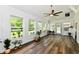 Bright and airy sunroom with large windows and hardwood floors; an ideal space for relaxation at 16857 Palmetto Way, Noblesville, IN 46062