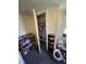 Bedroom closet providing space for storage with a small shelving unit on the side at 1801 E 16Th St, Muncie, IN 47302