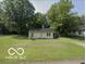 Charming single-story home with well-maintained lawn and mature trees at 1801 E 16Th St, Muncie, IN 47302