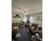 Inviting living room featuring a ceiling fan and windows for ample natural light at 1801 E 16Th St, Muncie, IN 47302