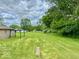 Expansive green backyard with mature trees and open space, perfect for outdoor activities and entertaining at 1920 E Epler E Ave, Indianapolis, IN 46227