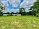 Spacious backyard view with manicured lawn and mature trees at 1920 E Epler E Ave, Indianapolis, IN 46227