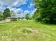 Expansive backyard featuring lush green grass and mature trees at 1920 E Epler E Ave, Indianapolis, IN 46227