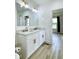Bright bathroom featuring a double vanity with marble countertop and modern gold fixtures at 1920 E Epler E Ave, Indianapolis, IN 46227