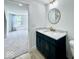 Modern bathroom features sleek vanity with marble countertop and gold fixtures at 1920 E Epler E Ave, Indianapolis, IN 46227