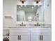Bright bathroom featuring a double vanity with marble countertop and modern bronze fixtures at 1920 E Epler E Ave, Indianapolis, IN 46227