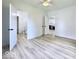 Bedroom featuring neutral walls, wood-look floors, a ceiling fan, and ensuite bathroom at 1920 E Epler E Ave, Indianapolis, IN 46227