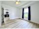 Bedroom showcasing neutral walls, wood-look floors, natural light, and access to the kitchen at 1920 E Epler E Ave, Indianapolis, IN 46227