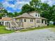 Charming exterior of a stone home featuring a side deck and well-maintained landscaping on a sunny day at 1920 E Epler E Ave, Indianapolis, IN 46227