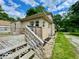Stone home with inviting deck and mature trees, offering a serene setting at 1920 E Epler E Ave, Indianapolis, IN 46227