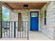 Close up of welcoming front porch, with a blue door and stone accents at 1920 E Epler E Ave, Indianapolis, IN 46227