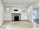 Sunlit living area with fireplace and fresh, white walls at 1920 E Epler E Ave, Indianapolis, IN 46227